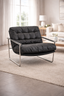 Archer arm chair front view in living space highlighting tufted upholstery and supportive cushioning.