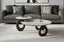 Cooper swivel coffee table set styled in modern living room with sofa and contemporary decor.