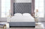 Ella Winged Bed in grey velvet styled in a contemporary bedroom interior.