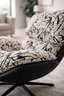 Close up of Enzo chair black and white textured fabric upholstery and plush cushioning detail.