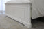 Close-up view of the Hamptons white bed footboard showcasing panel detailing and coastal design.