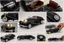 A collage of multiple product views showing a black vintage convertible car model or toy car, including exterior angles, interior details, wheels, headlights, and a hand holding one of the cars. The product is photographed on a light gray studio background.