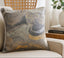 Decorative pillow with wavy pattern on a couch