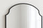 Close-up of Adair arch mirror showing matte black metal frame and curved top design.
