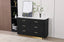 black fluted dresser with marble top styled in modern bedroom