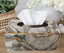 Decorative Atlantic marble tissue box styled on table with flowers for modern décor.
