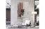 Oversized vertical white beaded framed mirror styled against wall in luxury living room