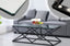Beverly coffee table in black frame with clear tempered glass top, sleek elegance.