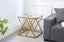 Beverly side table in gold polished frame with clear glass top, elegant accent.