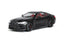 Black BMW M4 diecast model with red interior and sleek design.