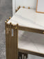 Close-up of Chelsea console table with polished gold frame and white marble top.