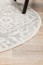 Curved edge of round Chrome Lydia Silver Rug on floor