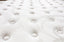 Close-up of Comfort Euro Top mattress surface showing breathable knitted fabric texture.