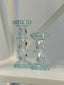 Luxurious crystal candle pillars in two sizes, perfect for creating a glamorous table centerpiece.