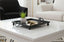 Black Square Mirror tray with a plant on a white coffee table in a living room setting
