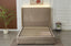 Front view of champagne velvet Elwood bed frame with gold trim and central storage drawers.