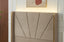 Close-up of champagne velvet Elwood bed headboard with gold trim and panelled design.