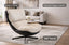 Cream Enzo swivel chair styled in a living room showing 360 degree swivel base and luxury design.