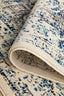  Folded view of the Evoke 21 White Rug illustrating pile thickness, durability, and backing material.