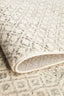 Folded edge of Evoke 265 Grey Rug highlighting its thick pile and durable polypropylene weave.
