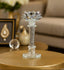 Decorative crystal candle holder on a table with a blurred background