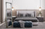 Silver ornate French provincial free standing mirror styled in modern bedroom with grey bed and ottoman.