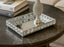 Decorative mirror silver tray with a matching pedestal on a marble table