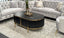 Kingsley black coffee table with gold trim styled in living room