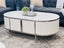 Kingsley white coffee table with silver trim styled with sofas