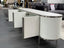 Kingsley TV Unit in white with silver trim, side view showing open storage doors.