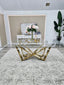 Lenox Dining Table in polished gold frame with clear glass top styled beautifully.