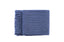 Levi Throw Rug Blanket in deep blue, folded neatly with textured weave and fringe edges.