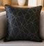 Decorative pillow with gold geometric pattern on a couch