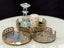 Decorative gold round Lucy tray set of 3 styled with candles and crystal décor – perfect for elegant tabletop accents.