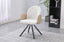 Beige swivel dining chair styled in bright interior adding warmth comfort and modern character