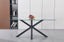 Miles rectangle dining table with black metal frame and clear tempered glass top in a modern setting.