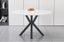 Miles round dining table with black frame and white marble top, stylish modern design.