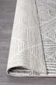 Folded corner of Oasis Silver Rug showing fine weave