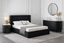 Sleek black Opal dresser with marble top enhancing modern bedroom with bold sophisticated storage paired with hilton bed 