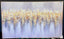 Framed orchard canvas art displayed beautifully in modern interior.