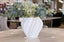 Quinn 3D print vase displayed on dining table with greenery in a modern interior setting.