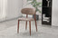 Tan Riley dining chair styled in modern interior adding warmth comfort and elegant character