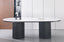 Ripple Oval Dining Table with white marble top styled in elegant modern dining space.