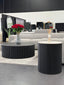Ripple coffee and side table styled in living room with grey sofa and flowers