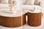 Travertine stone surface and walnut ribbed base detail showcasing premium natural materials