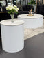 Ripple coffee and side table with white ribbed base styled in modern living room