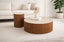 Walnut round coffee and side tables styled in bright lounge creating warm inviting atmosphere