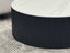 Ripple round black base coffee table with white marble top in modern living room