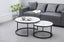 Romana nesting coffee tables in black frame with marble tops styled in a modern living room.
