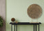 Elegant gold round pressed table décor styled on a console table for a luxe touch.